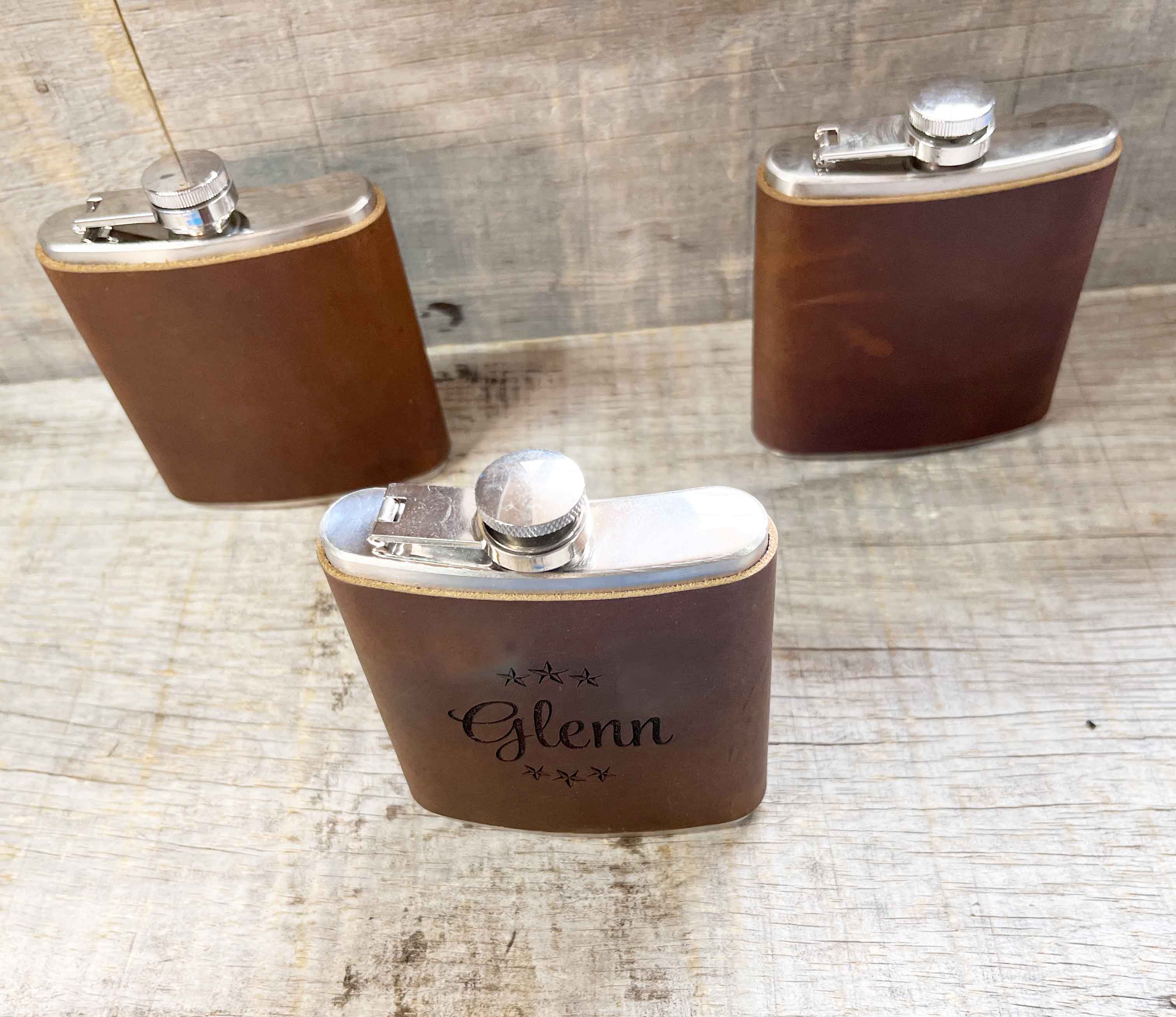 Cowboy Leather Engraved Flasks.