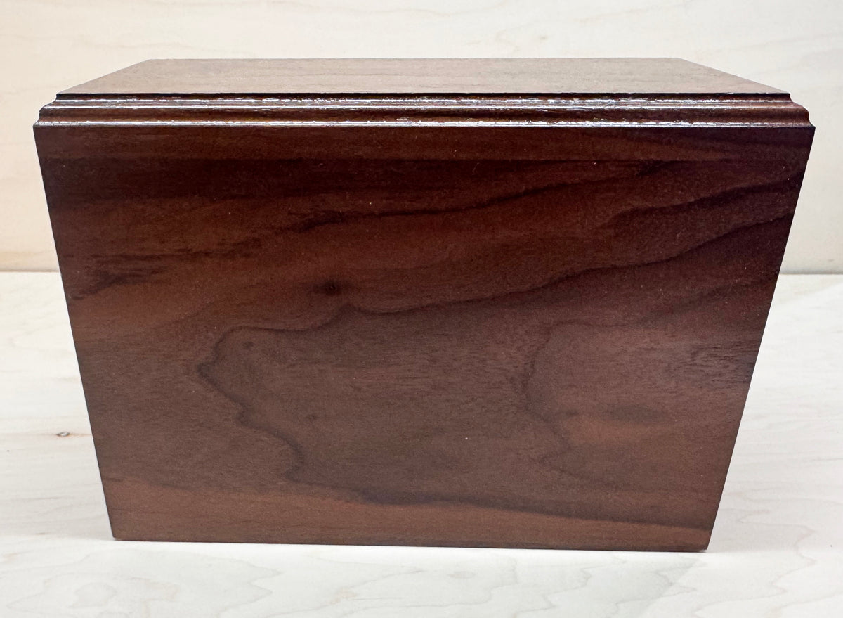 Wooden box with a lid on a white background