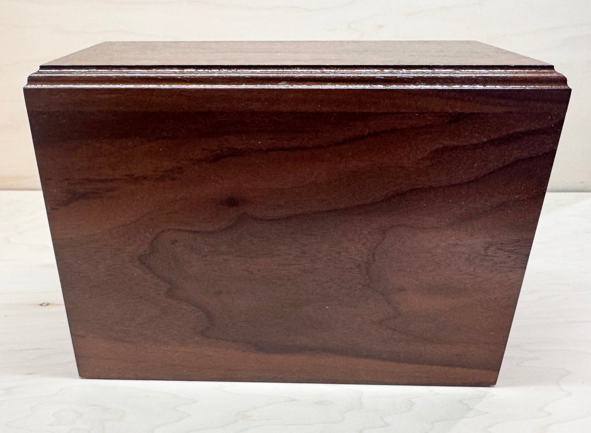 Wooden box with a lid on a white background