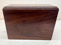 Wooden box with a lid on a white background