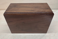 Wooden box with a dark brown finish on a light gray background