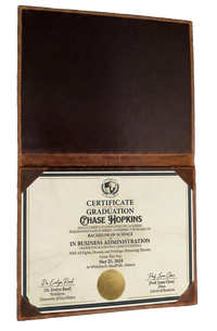 Professional leather certificate cover made in Canada featuring secure corner tabs and personalized laser engraving for