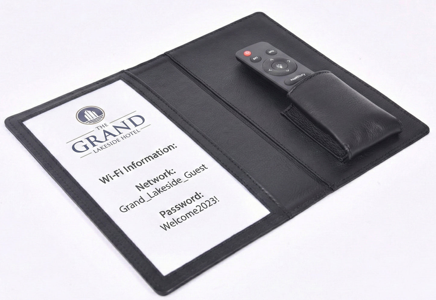 Personalized black full-grain leather TV remote case with custom embossed Memories Made logo for luxury home organization.