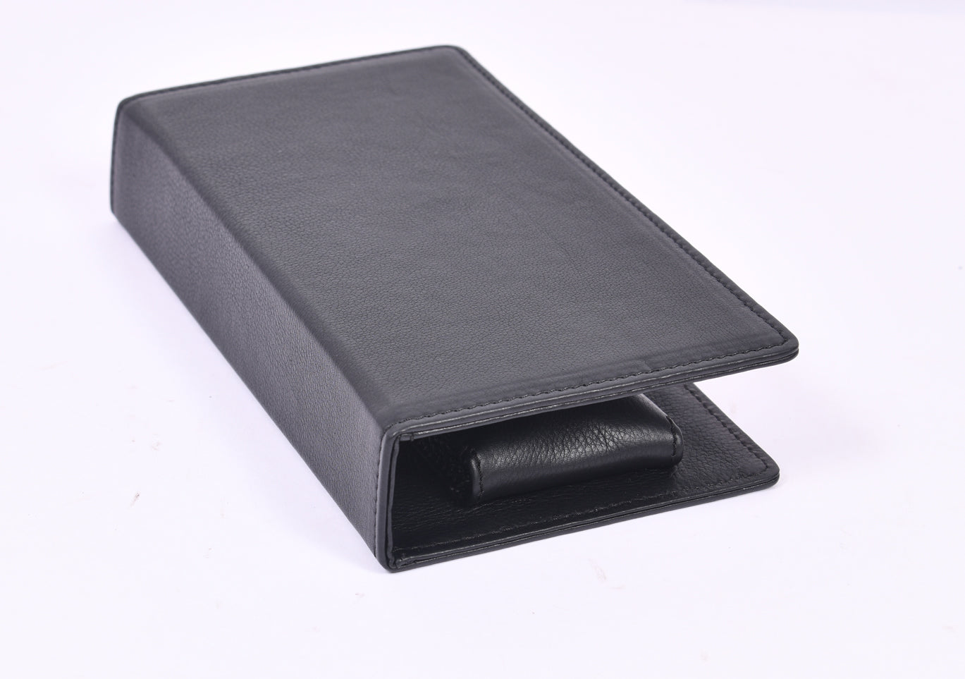 Personalized black full-grain leather TV remote case with custom embossed Memories Made logo for luxury home organization.