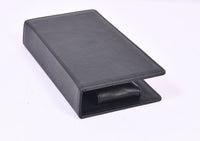 Personalized black full-grain leather TV remote case with custom embossed Memories Made logo for luxury home organization.