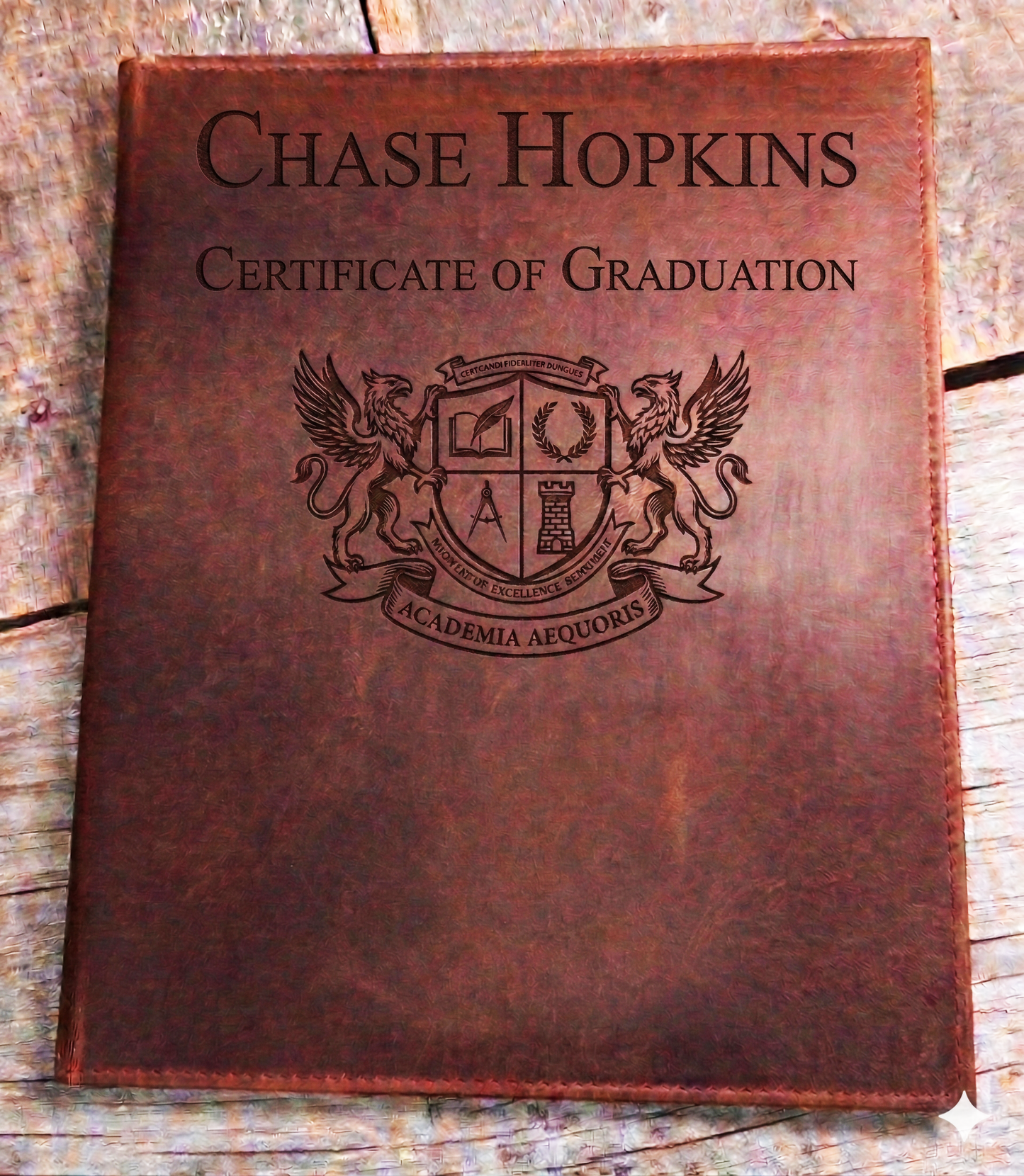 Professional leather certificate cover made in Canada featuring secure corner tabs and personalized laser engraving for