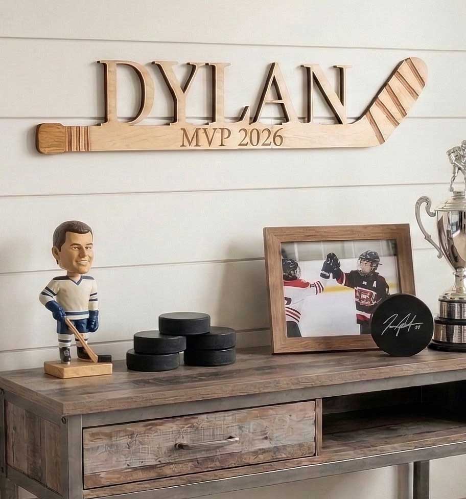 Personalized wooden mini hockey stick with custom laser-cut name.