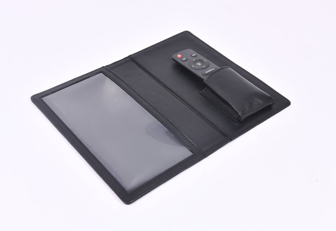 Personalized black full-grain leather TV remote case with custom embossed Memories Made logo for luxury home organization.