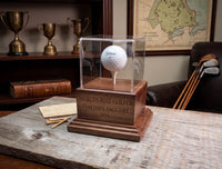 golf ball hole in one trophy case