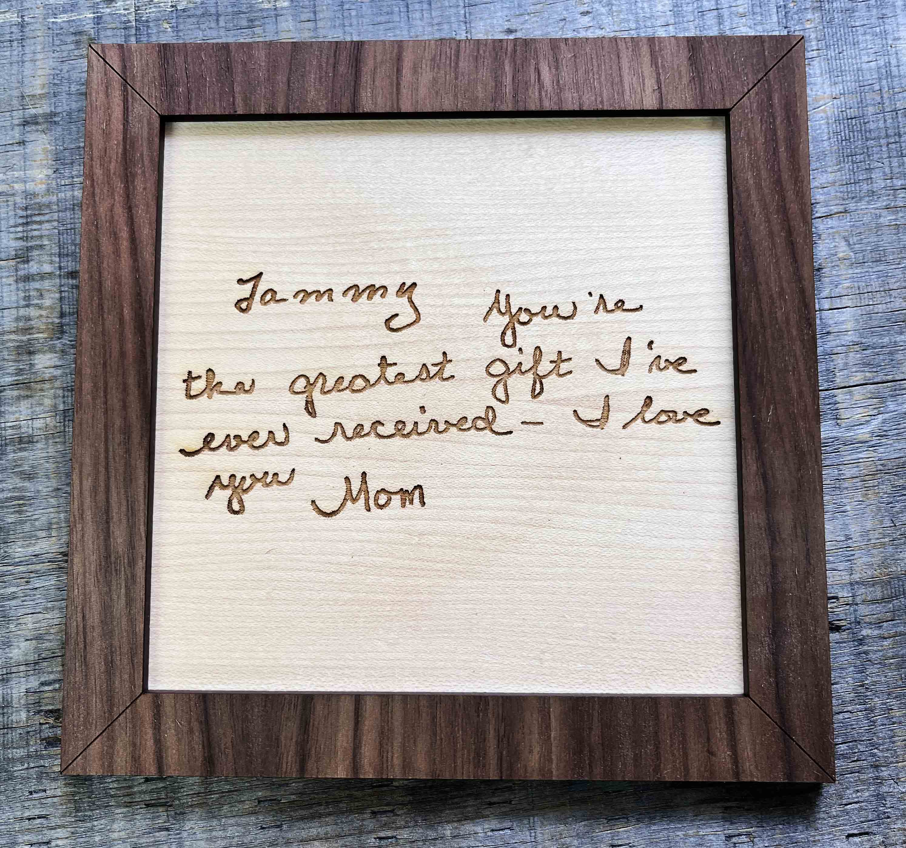 Handwriting engraved into Wood Sign.
