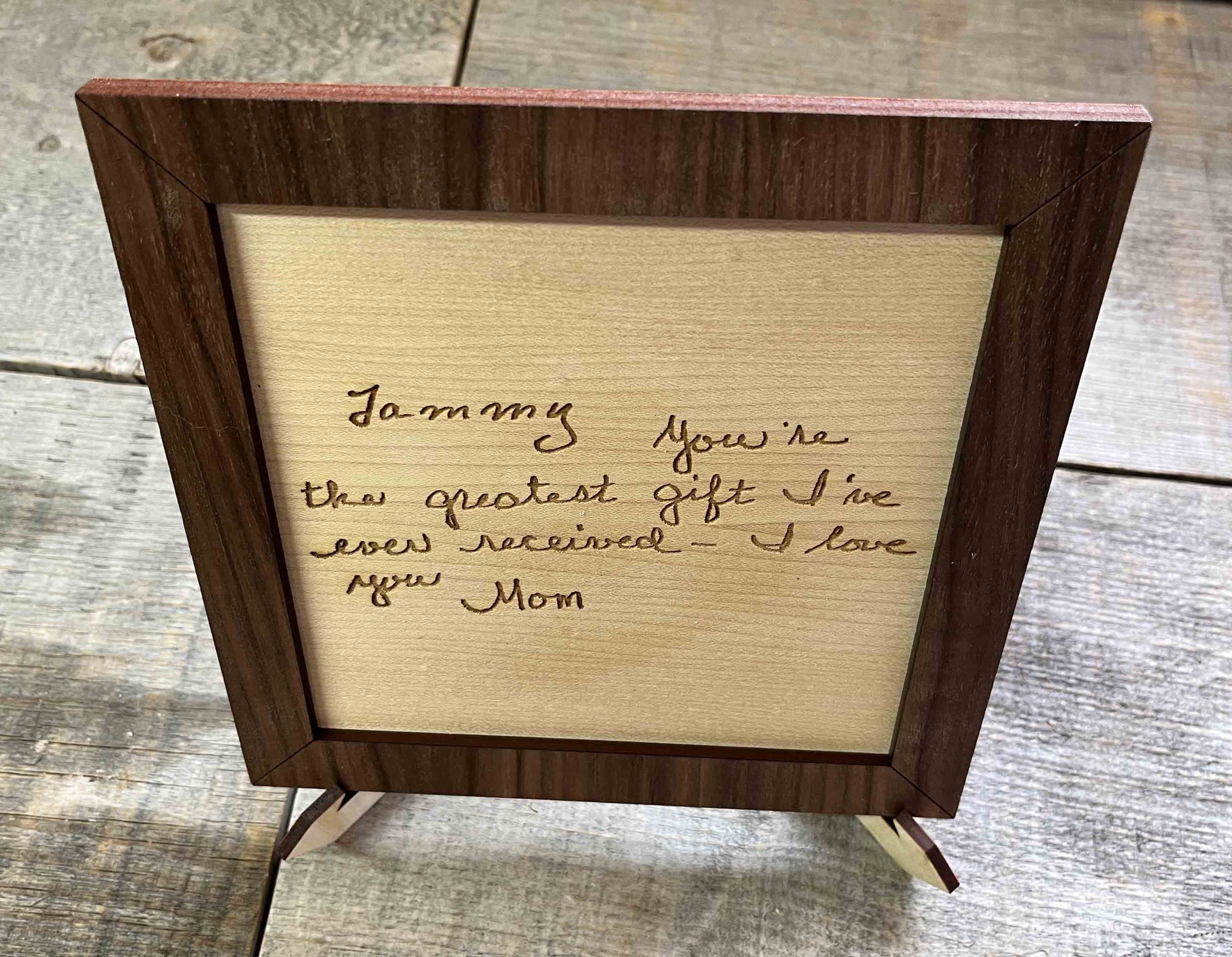 Handwriting engraved into Wood Sign.