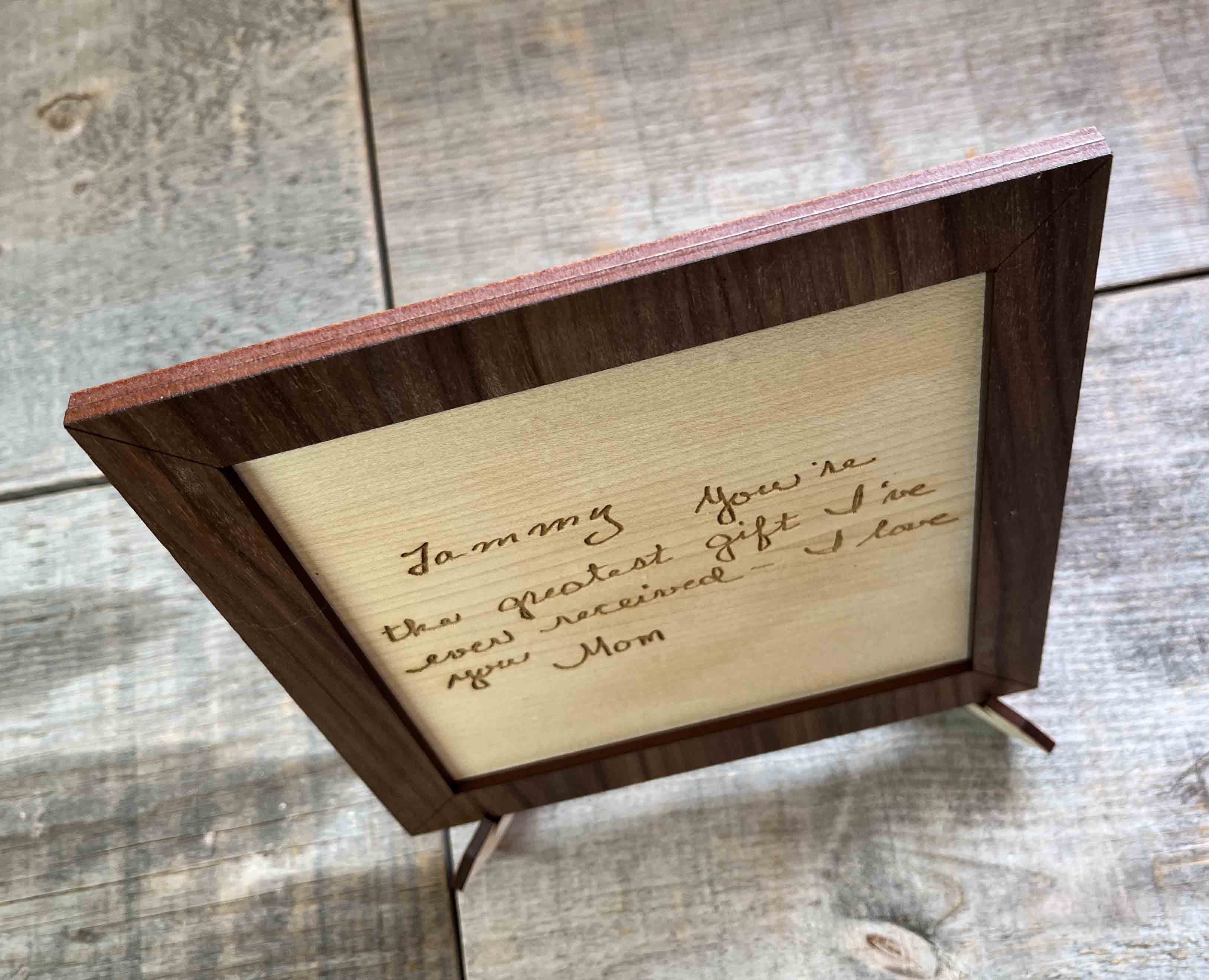 Handwriting engraved into Wood Sign.